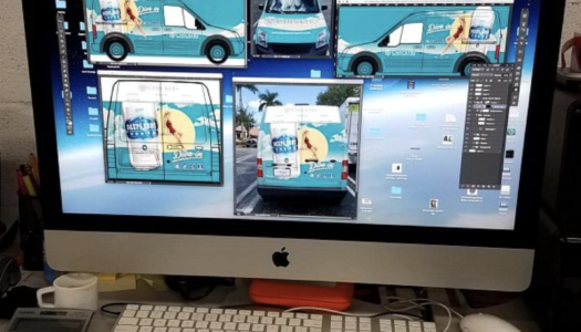 computer with graphic design images of a fleet van wrap